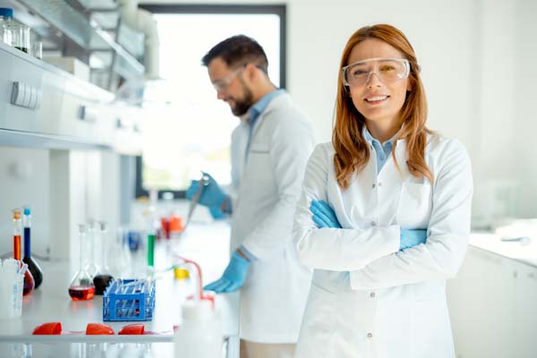 Smiling Female Scientist Looking at Camera